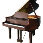 baby grand piano in dark walnut