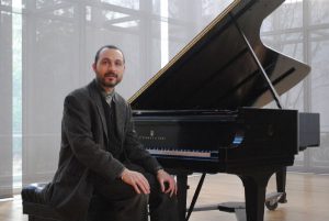 Antonio-in-front-of-the-piano-600